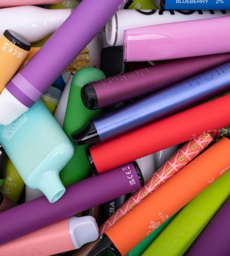 Prague, CZ - 09 August 2023: Synthetic nicotine concepts. Various types of disposable electronic cigarettes. modern alternative smoking, vaping and nicotine. Close up. Editorial